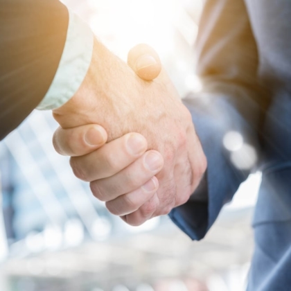 Close-up of two men shaking hand