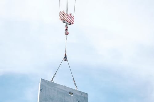 Precast structural concrete product being transported by a construction bim