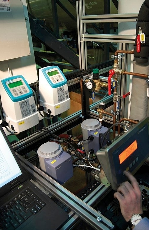 Employee conducting a heat pump test in a controled facility