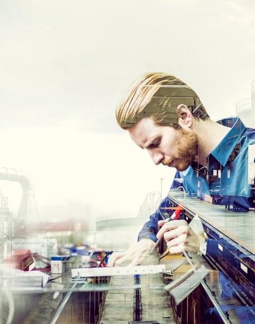 Illustration: Man jobbar i ett laboratorium för materialtester.