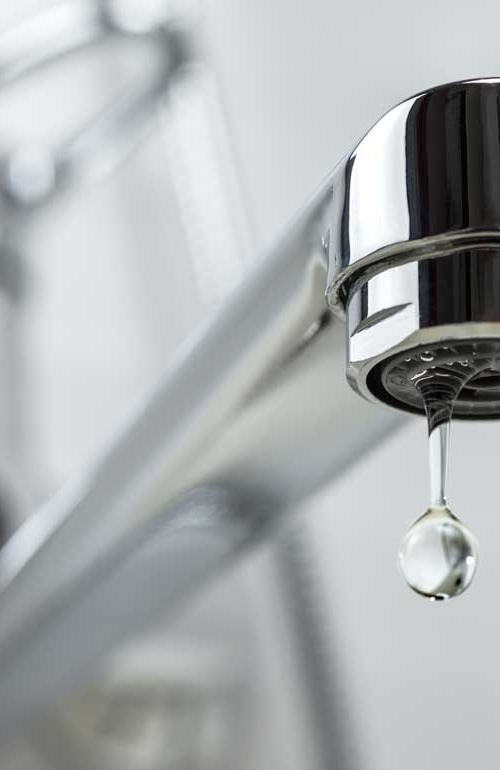 single drop of water falling from a tap