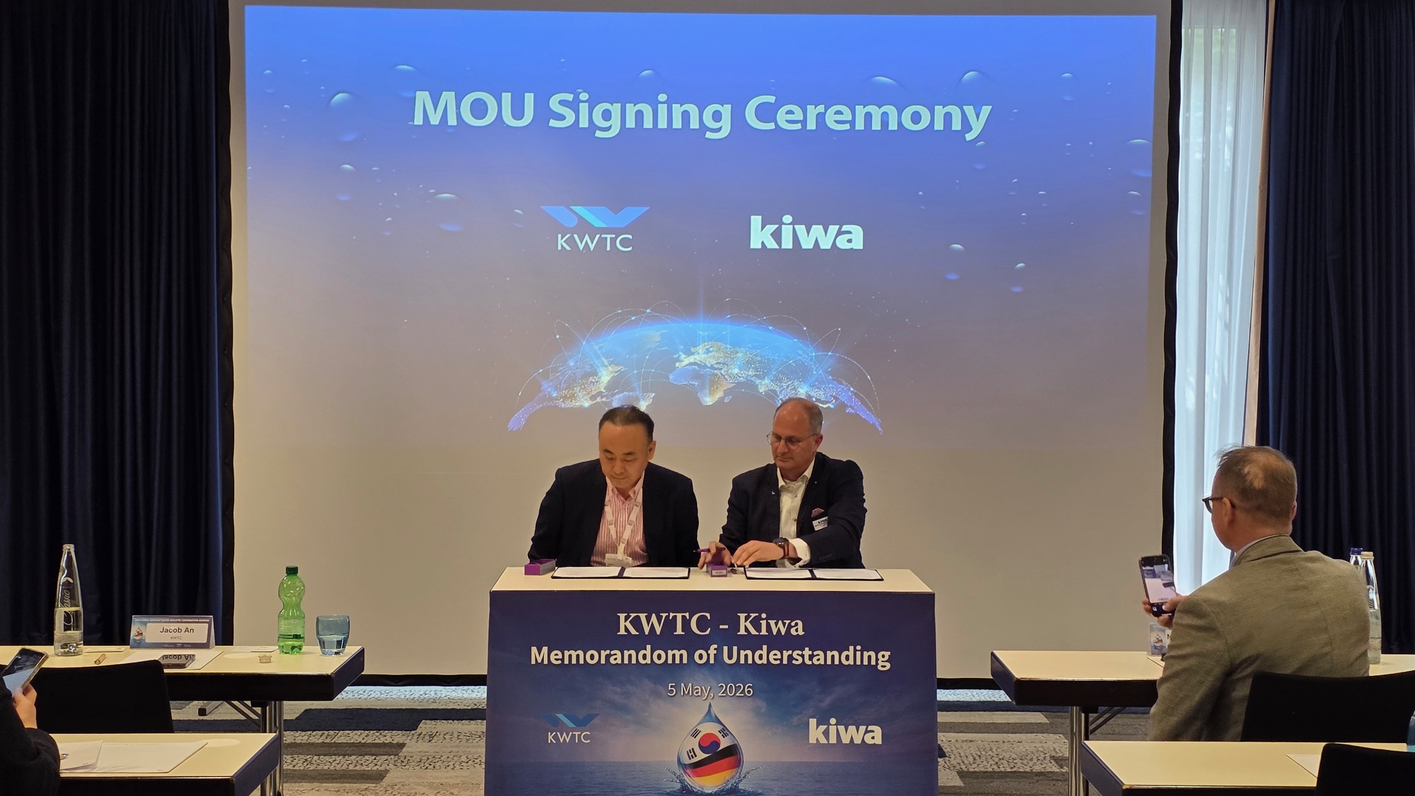 Colleagues signing agreement