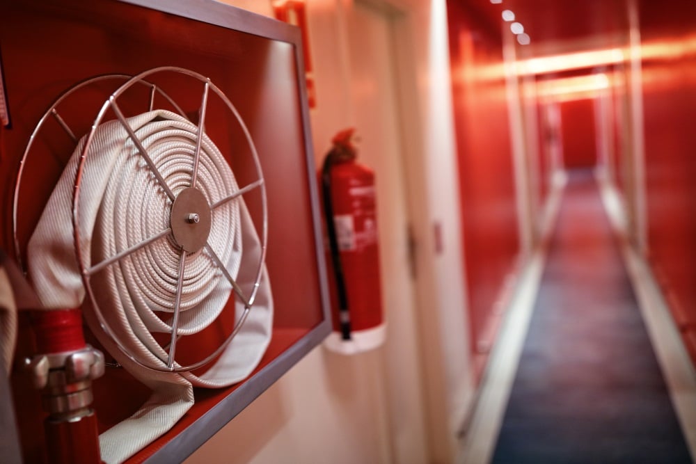 Fire hose reel and a fire extinguisher for fire safety and security
