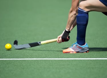Hockeyer op hockeyveld