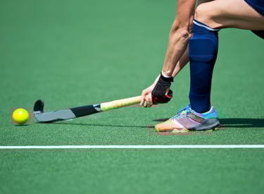 Hockeyer op hockeyveld