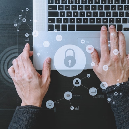 Someone typing on a laptop - cyber security