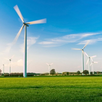 Windmill field with blue sky