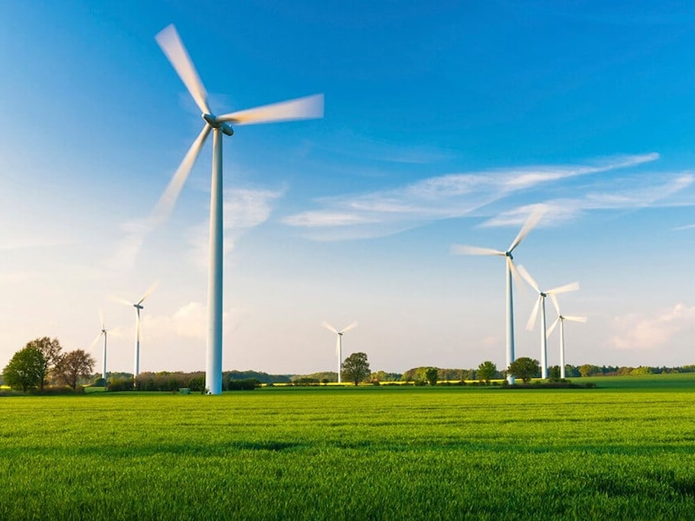 Windmill field with blue sky
