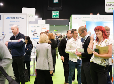 people wandering an exhibition hall